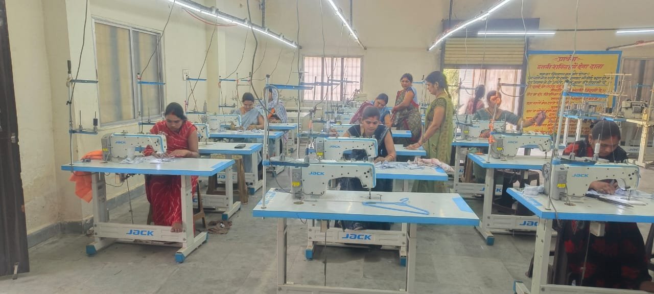 Women taking part in sewing training and women empowerment activities